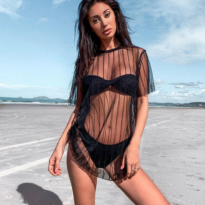 Kvinnors transparent strandtunika med vertikala ränder och vid skärning design Mirla-Eva Jonsson