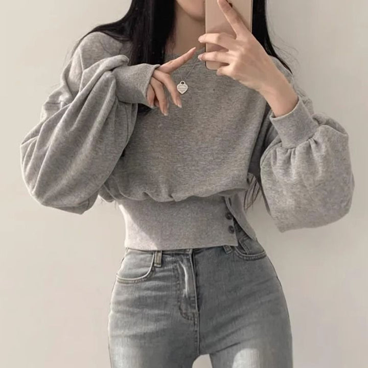Kvinnors trendiga cropped sweatshirt med puffärmar Mirla-Eva Jonsson