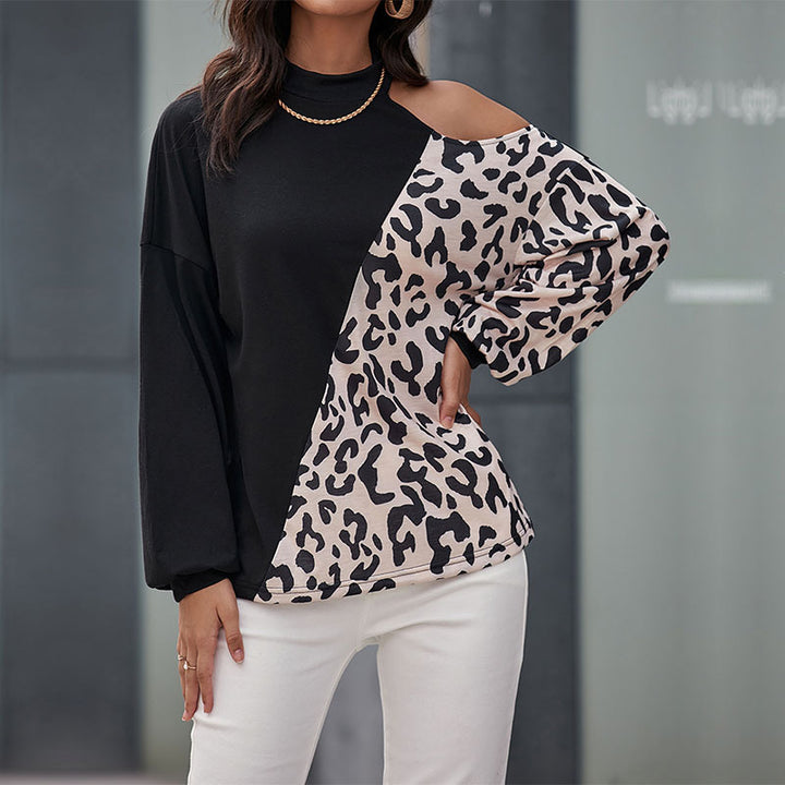 Kvinnors trendiga långärmad skjorta med leopardmönster och asymmetriska insatser Mirla-Eva Jonsson