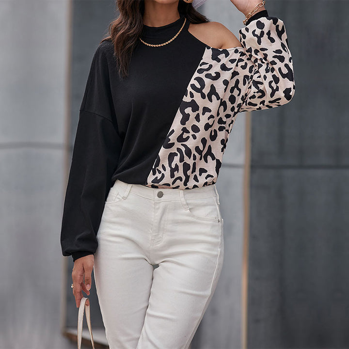 Kvinnors trendiga långärmad skjorta med leopardmönster och asymmetriska insatser Mirla-Eva Jonsson