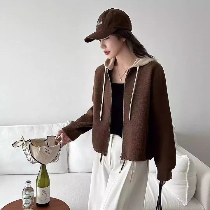 Kvinnors trendiga vadderade jacka med huva och dubbel dragkedja Mirla-Eva Jonsson