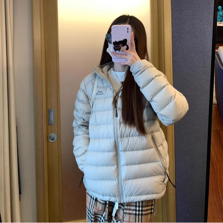 Kvinnors vadderad vinterjacka med hög krage och praktiska sidofickor-Eva Jonsson