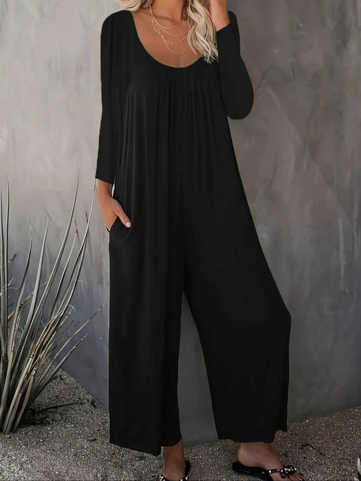 Kvinnors vid-skuren jumpsuit med praktiska fickor och modern skärning Mirla-Eva Jonsson