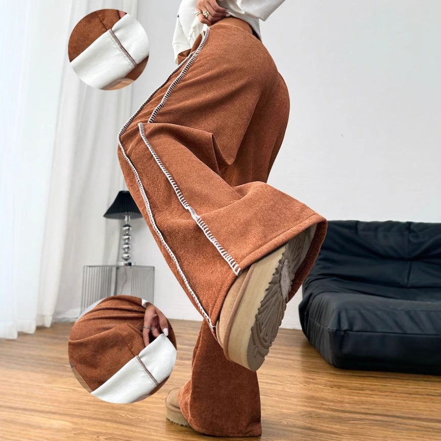 Kvinnors vida fritidsbyxor i mjuk velour med elastisk midja och dekorativ dragsko Mirla-Eva Jonsson