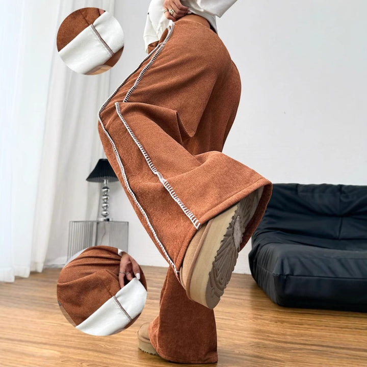 Kvinnors vida fritidsbyxor i mjuk velour med elastisk midja och dekorativ dragsko Mirla-Eva Jonsson