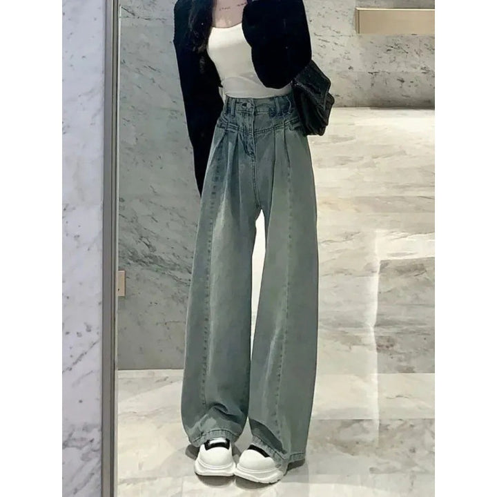 Kvinnors vida högmidjade jeans med elegant midjebandsdesign Mirla-Eva Jonsson