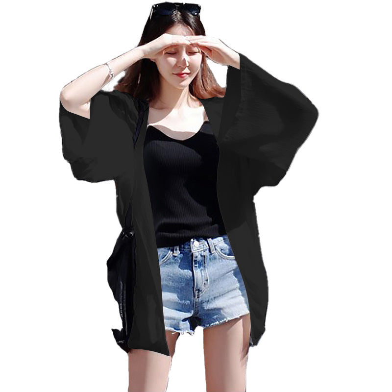 Kvinnorsk elegant kimono jacka med en lös passform och intrikat designade ärmar-Eva Jonsson