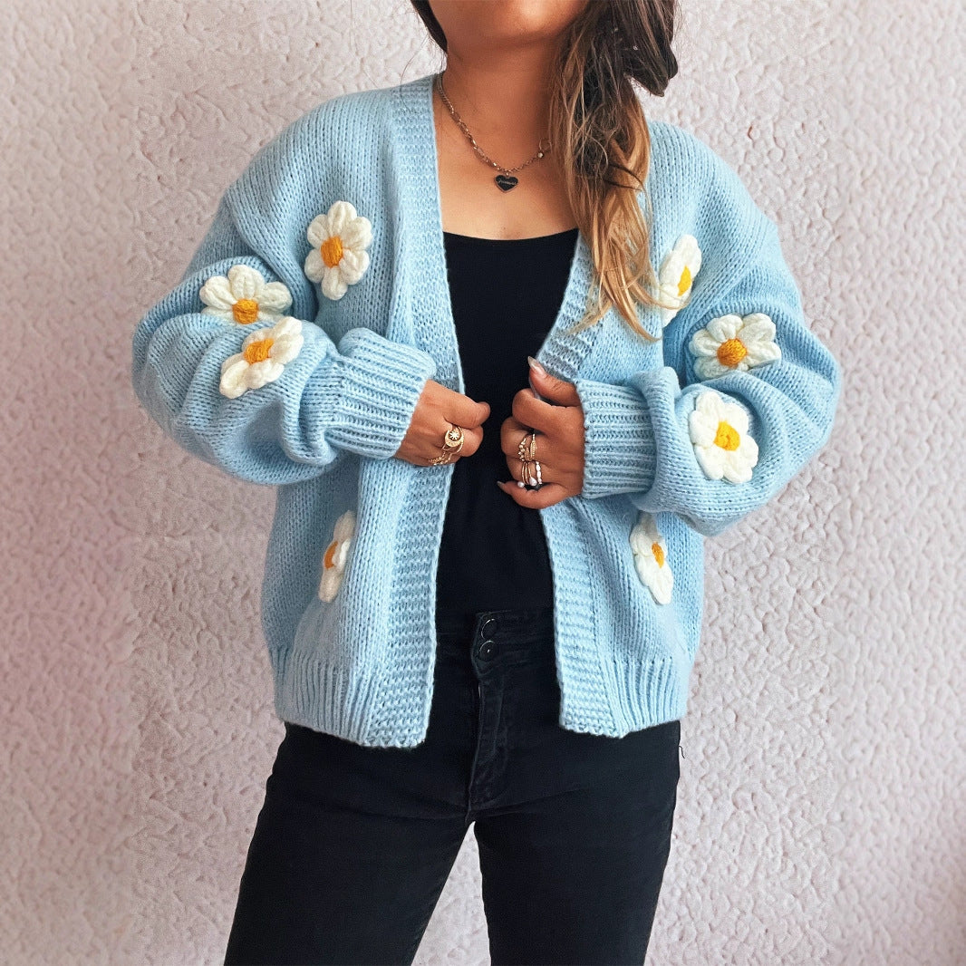 Kvinnotröja med blommönsterapplikationer Mirla-Eva Jonsson