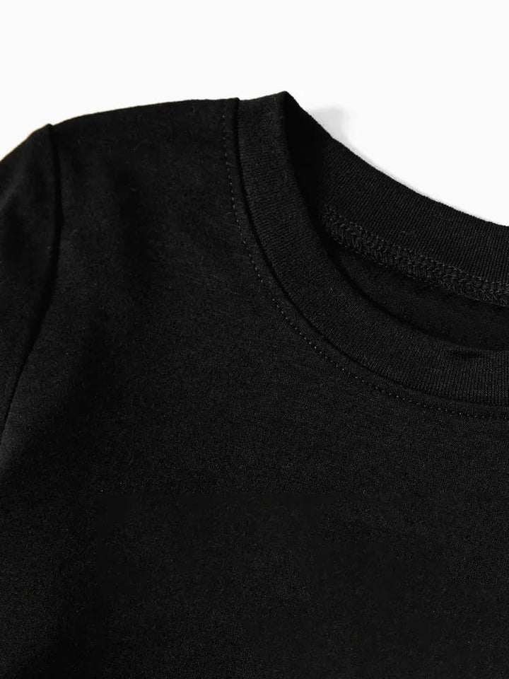 Mirla | 2025 Familj Jul Tryck Svart Långärmad T-Shirt med Svart-Vita Rutmönstrade Byxor Familjematchande Pyjamas-Eva Jonsson
