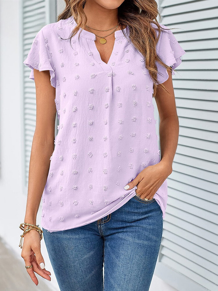 Mirla | Blus med lapptäck och volanger-Eva Jonsson