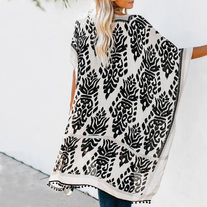 Mirla | Bohemisk Kimono med blommönster och fransdetalj-Eva Jonsson