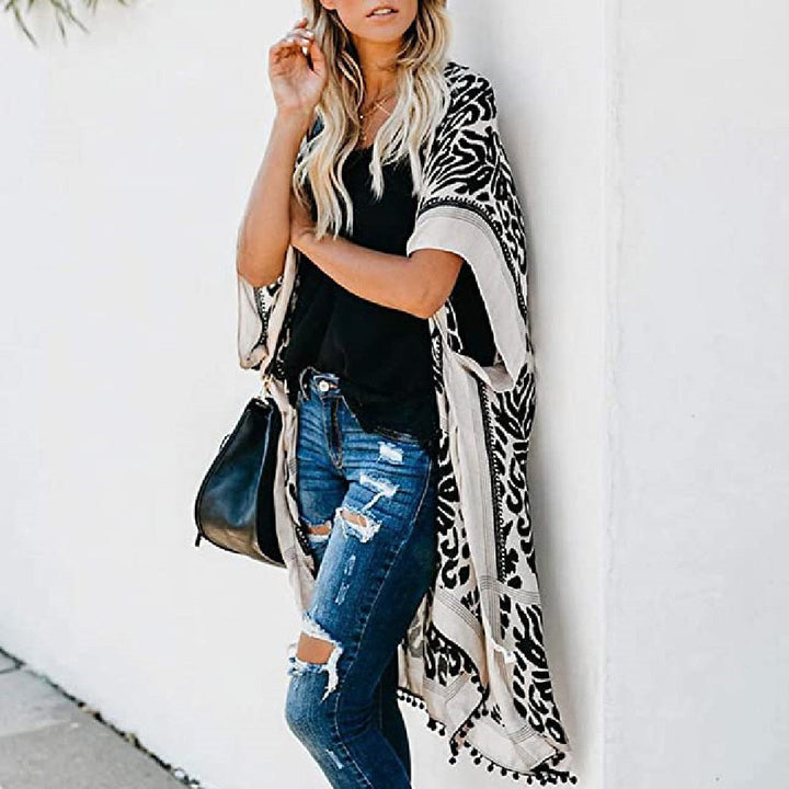 Mirla | Bohemisk Kimono med blommönster och fransdetalj-Eva Jonsson