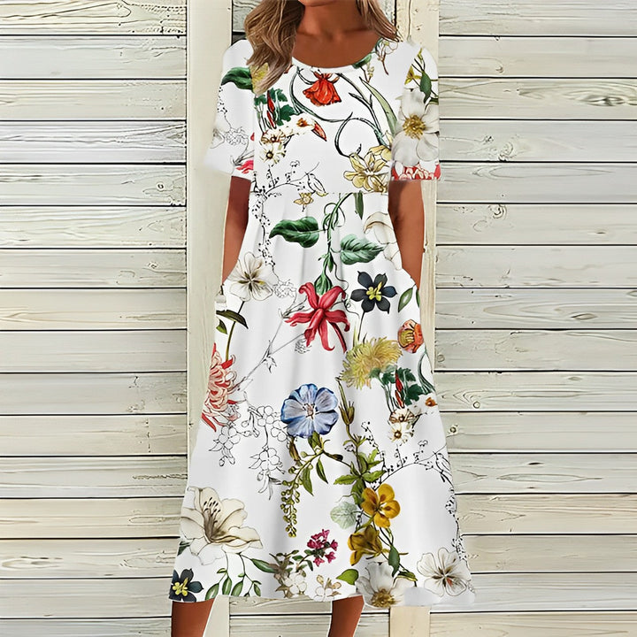 Mirla | Elegant Vit Blommig Midiklänning för Damer-Eva Jonsson