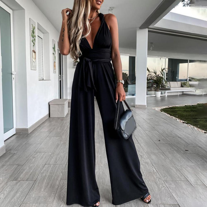 Mirla | Elegant ärmlös jumpsuit med djup V-ringning, midjeband och vid ben-Eva Jonsson
