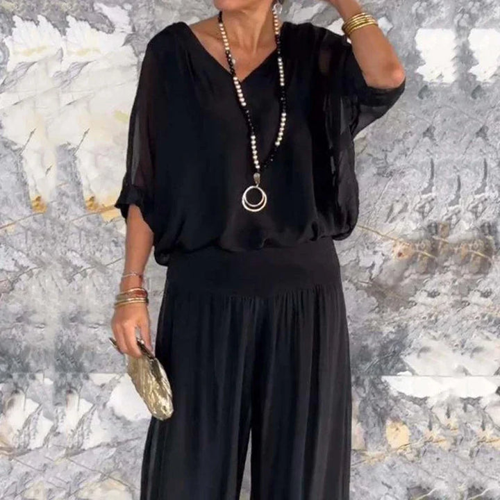 Mirla | Elegant tvådelat set av chiffong topp och byxor med vida ben-Eva Jonsson