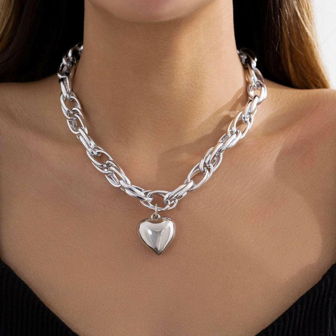 Mirla | Guld hjärta hängande halsband tidlös elegans med modern twist-Eva Jonsson