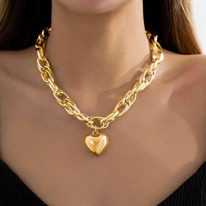 Mirla | Guld hjärta hängande halsband tidlös elegans med modern twist-Eva Jonsson