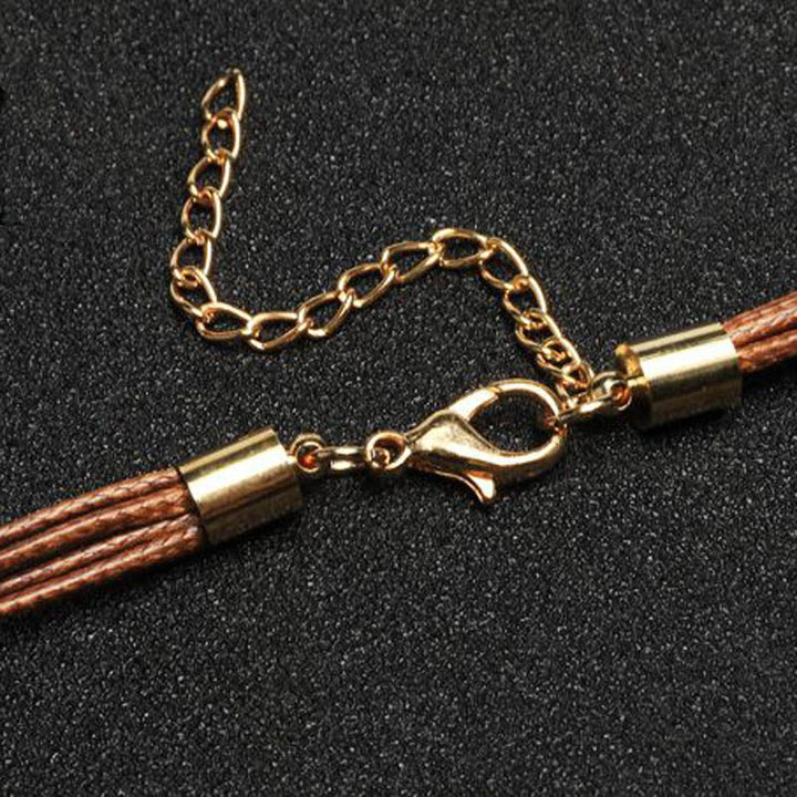 Mirla | Guldig fjäderhalsband i bohostil-Eva Jonsson