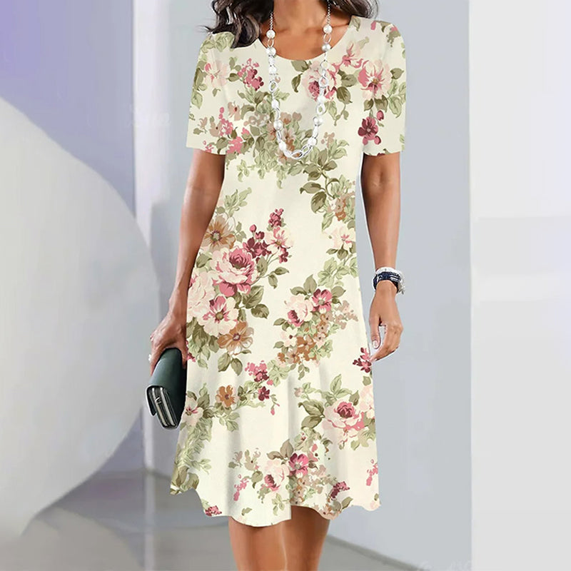 Mirla | Klänning Elegant klänning med rund halsringning och blommönster-Eva Jonsson