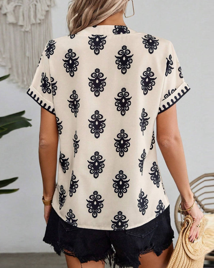Mirla | Kortärmad Elegant Blus med Tryck-Eva Jonsson