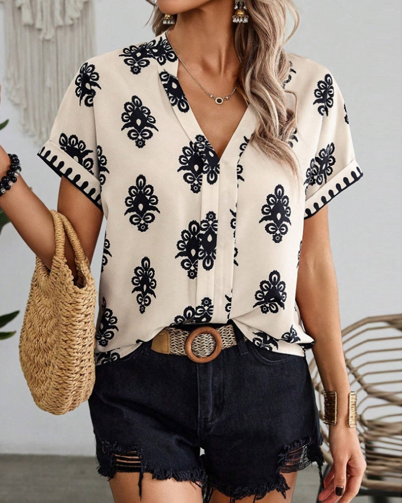 Mirla | Kortärmad Elegant Blus med Tryck-Eva Jonsson