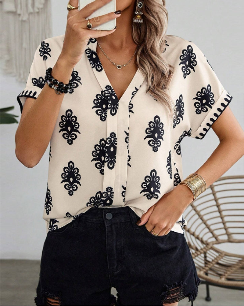 Mirla | Kortärmad Elegant Blus med Tryck-Eva Jonsson