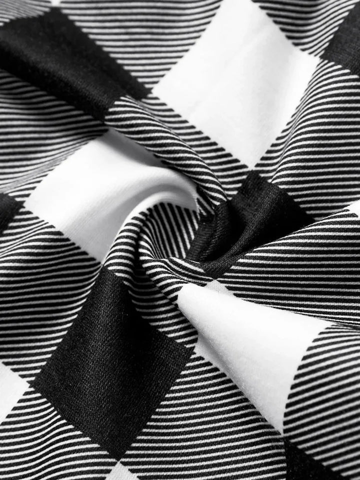 Mirla | Let It Snow Text And Snowman Print Black And White Checked Family Pajama-Eva Jonsson