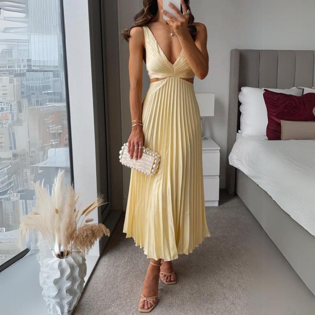 Mirla | Midi klänning ärmlös V-hals twist front & cut out detalj plisserad kjol-Eva Jonsson