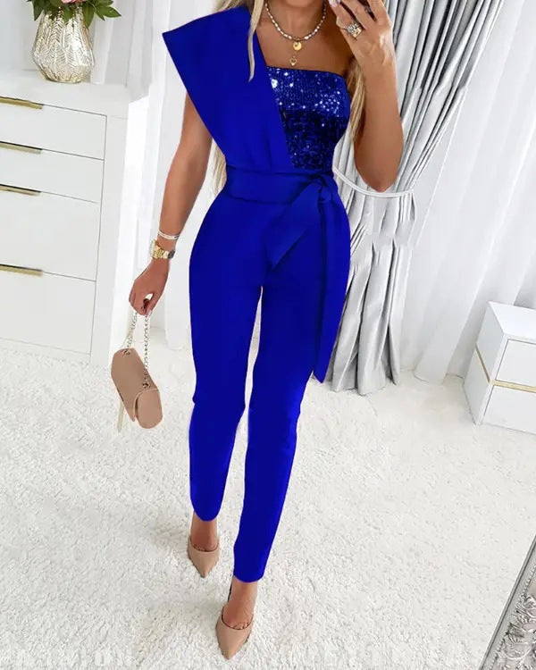 Mirla | One Shoulder Jumpsuit med paljetter och midjeband-Eva Jonsson