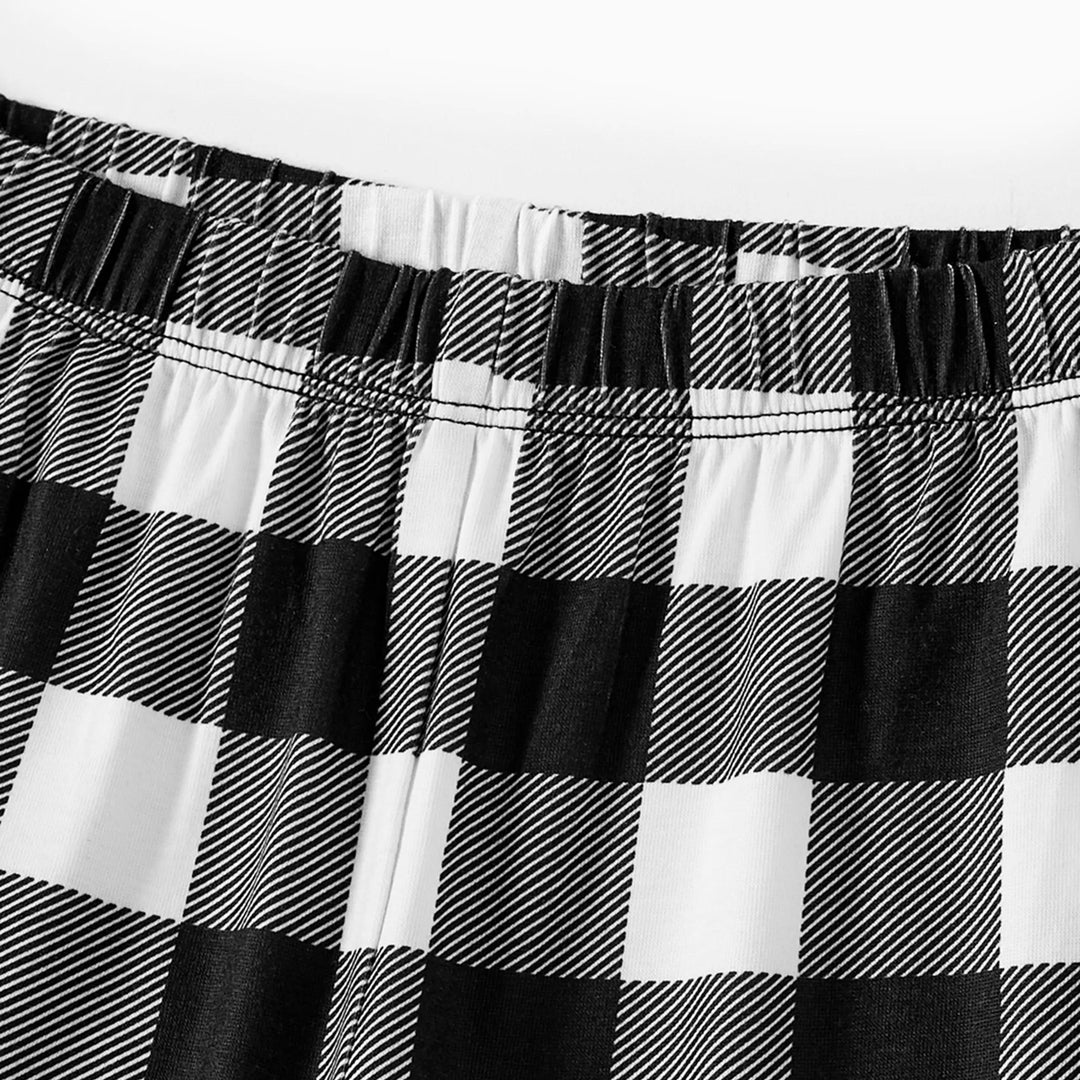 Mirla | Par Svart och Vitt Rutigt Jul Pyjamas Set med Julgran och Tecknad Mönster Tryck-Eva Jonsson