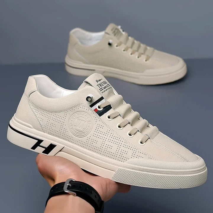 Mirla | Perforerade lädersneakers med logodetalj-Eva Jonsson