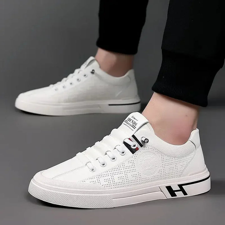 Mirla | Perforerade lädersneakers med logodetalj-Eva Jonsson