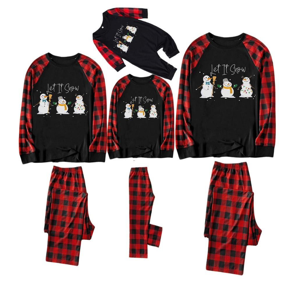 Mirla | Röd och Svart Rutig Julpyjamas-Set med Snögubbe- och Slogan-Designs-Eva Jonsson