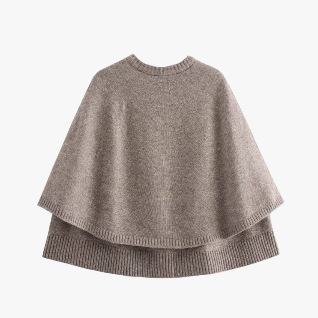 Mirla | Stickad cape med knappar och vågig fåll-Eva Jonsson