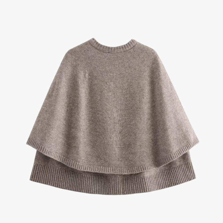 Mirla | Stickad cape med knappar och vågig fåll-Eva Jonsson