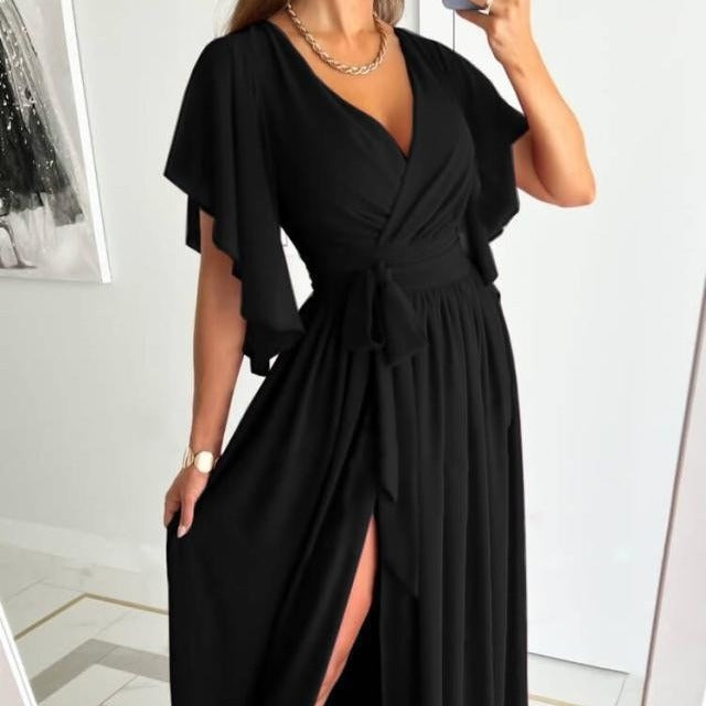 Damer Elegant Maxiklänning med voluminösa ärmar och stiligt benslits Eva Jonsson