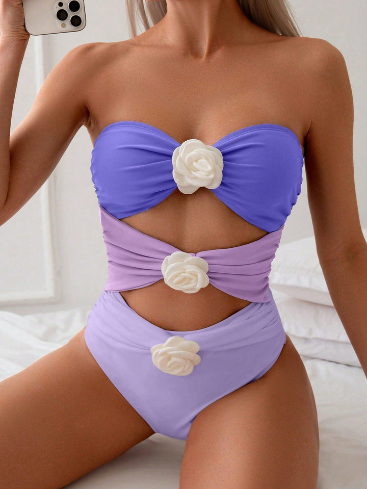 Damen Bandeau-Badeanzug mit eleganten Rüschen und floralen Akzenten Echo Archiv