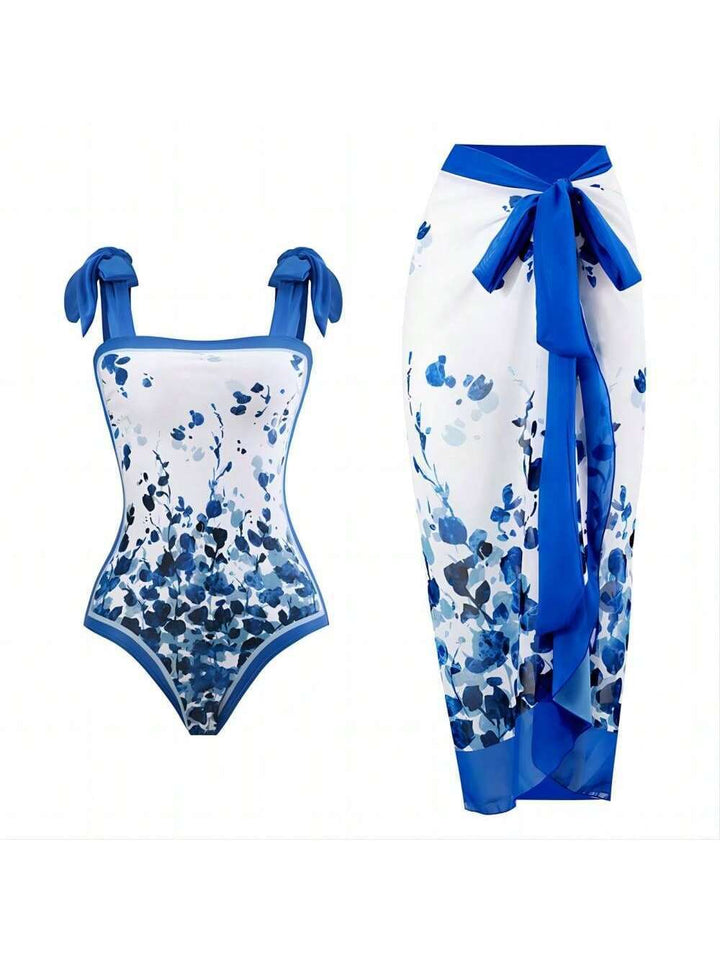 Damen Eleganter Badesuit mit floralen Akzenten und modischem Wickelrock Echo Archiv