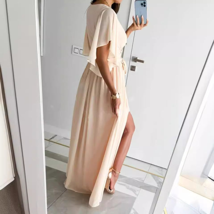Damer Elegant Maxiklänning med voluminösa ärmar och stiligt benslits Eva Jonsson