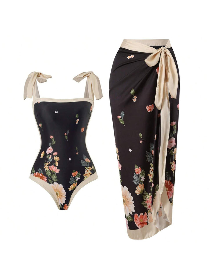 Damen Eleganter Badesuit mit floralen Akzenten und modischem Wickelrock Echo Archiv