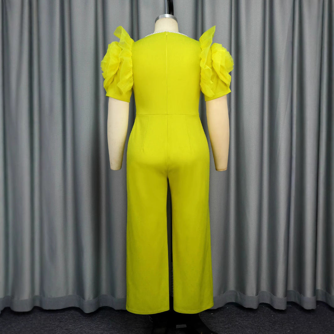 Damer elegant jumpsuit med voluminösa puffärmar och pärlaccent Mirla-Eva Jonsson