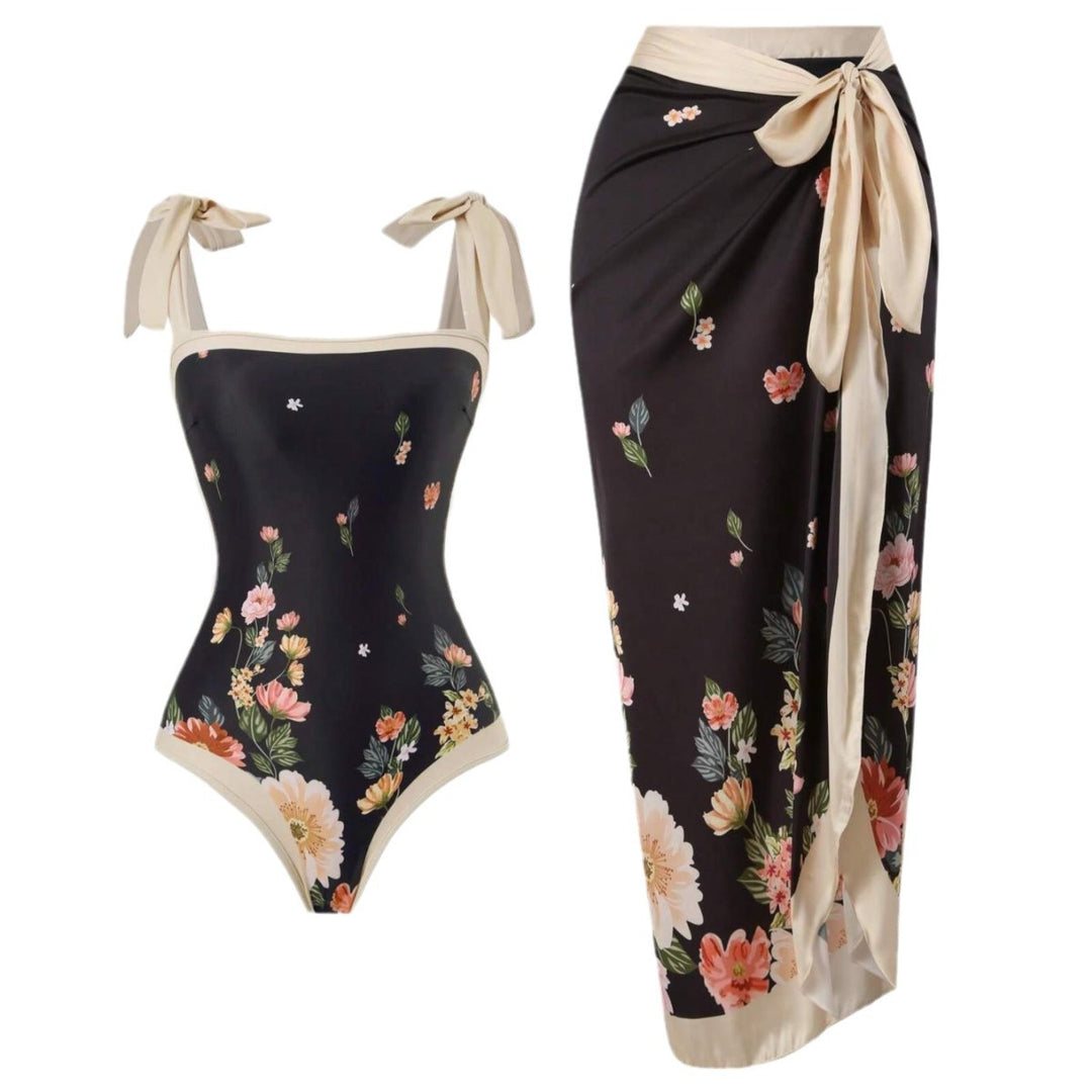 Damen Eleganter Badesuit mit floralen Akzenten und modischem Wickelrock Echo Archiv