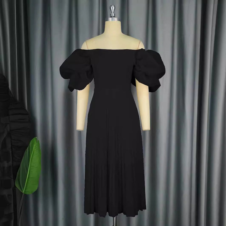 Dame Elegant klänning med voluminösa puffärmar och svängande kjol Mirla-Eva Jonsson