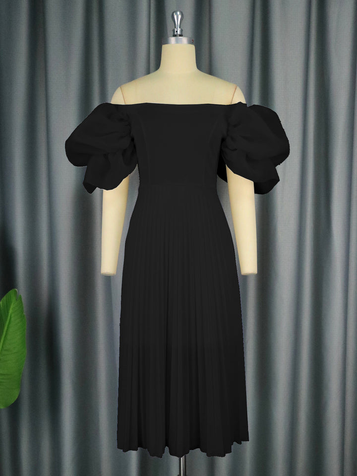 Dame Elegant klänning med voluminösa puffärmar och svängande kjol Mirla-Eva Jonsson