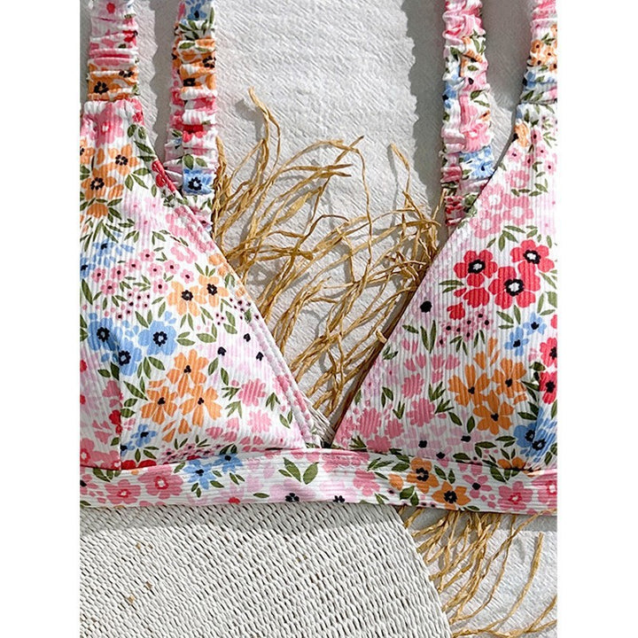 Dams triangel-bikiniöverdel med lekfullt blommönster Mirla-Eva Jonsson