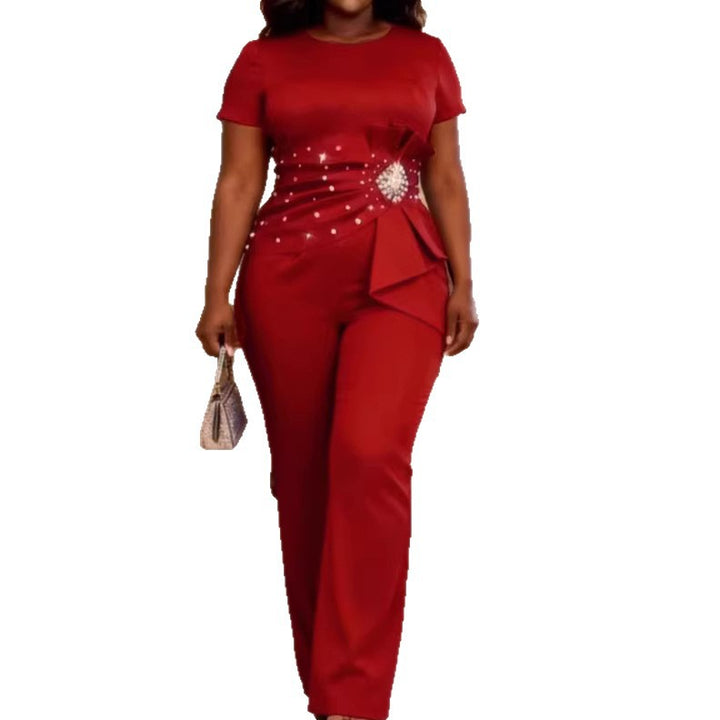 Dame elegant jumpsuit med figuranpassad silhuett och volangdetaljer Mirla-Eva Jonsson