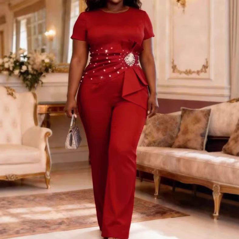 Dame elegant jumpsuit med figuranpassad silhuett och volangdetaljer Mirla-Eva Jonsson
