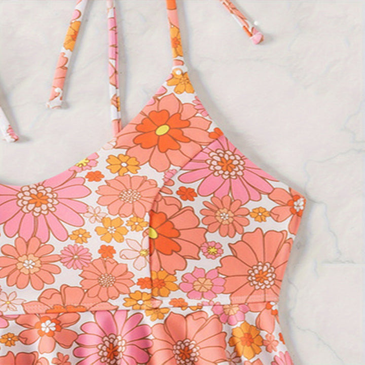 Damen attraktives Flatter-Badeoberteil mit floralem Design und passend hochgeschnittenem Slip Echo Archiv