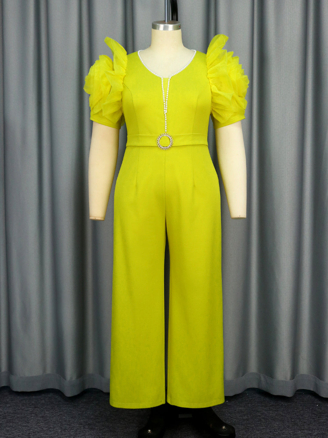 Damer elegant jumpsuit med voluminösa puffärmar och pärlaccent Mirla-Eva Jonsson