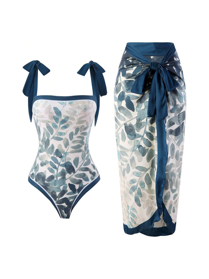 Damen Eleganter Badesuit mit floralen Akzenten und modischem Wickelrock Echo Archiv